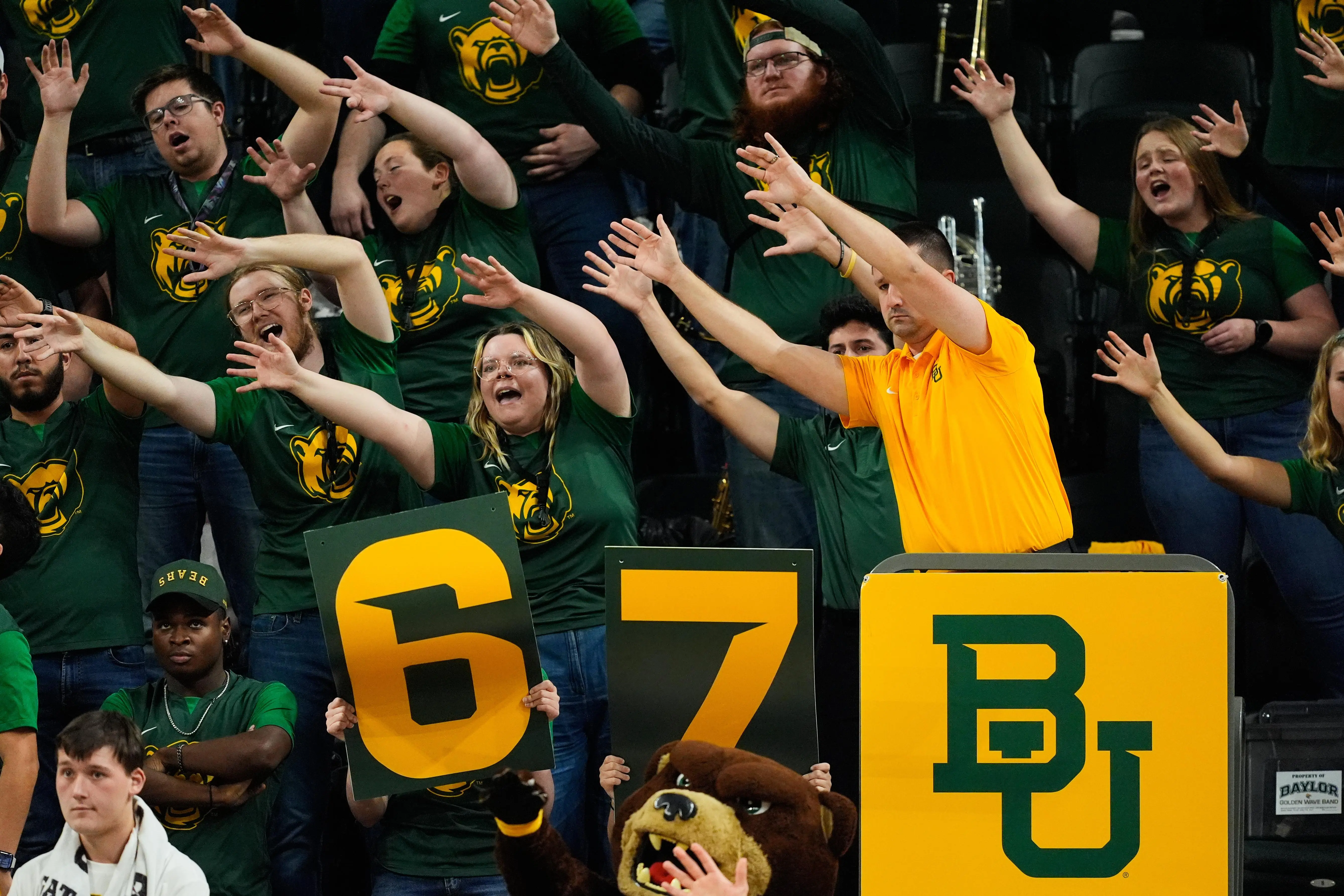 FILE – Baylor fans holding up a 6-7 sign cheer...