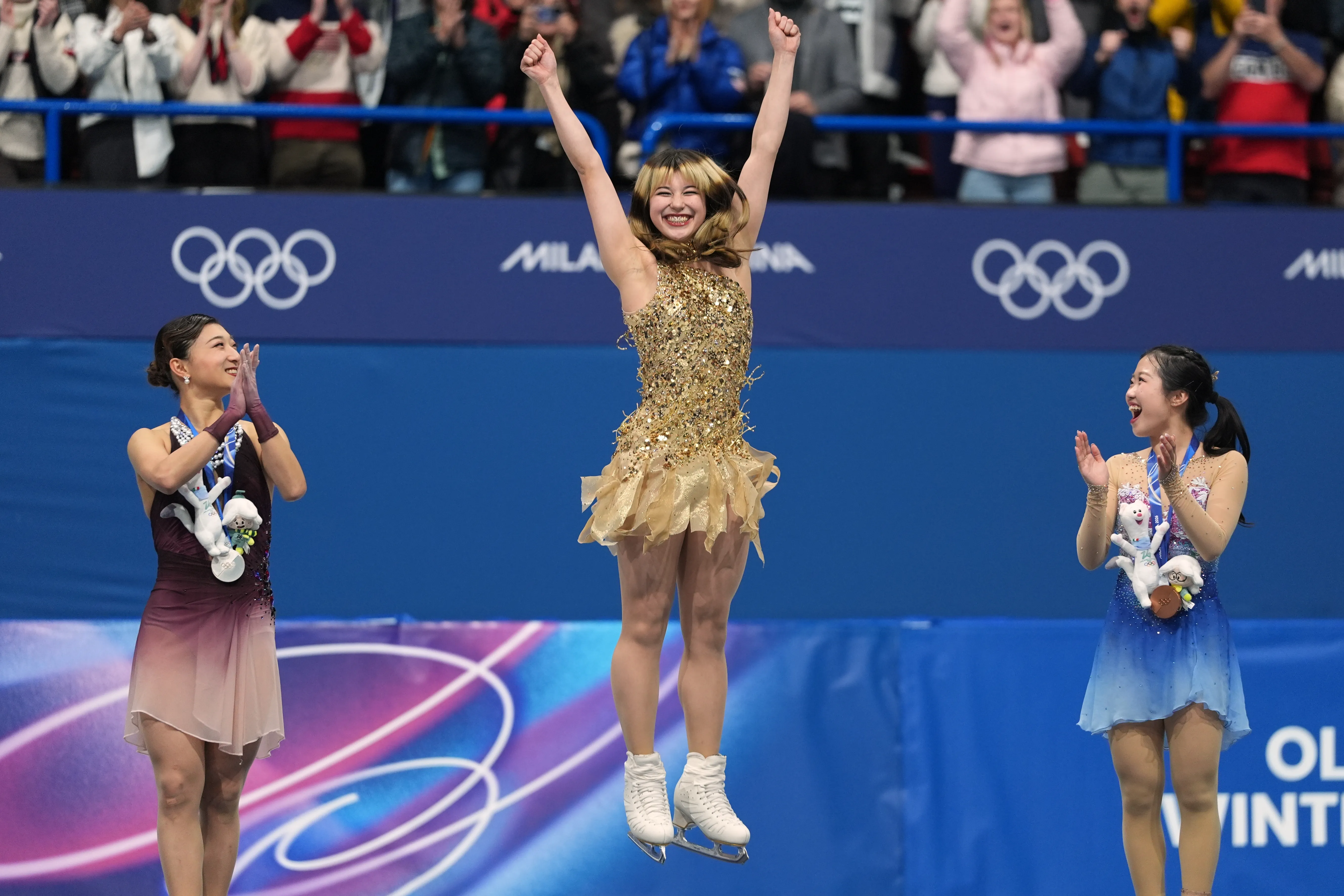 From left to right, silver medalist Kaori Sakamoto of Japan,...