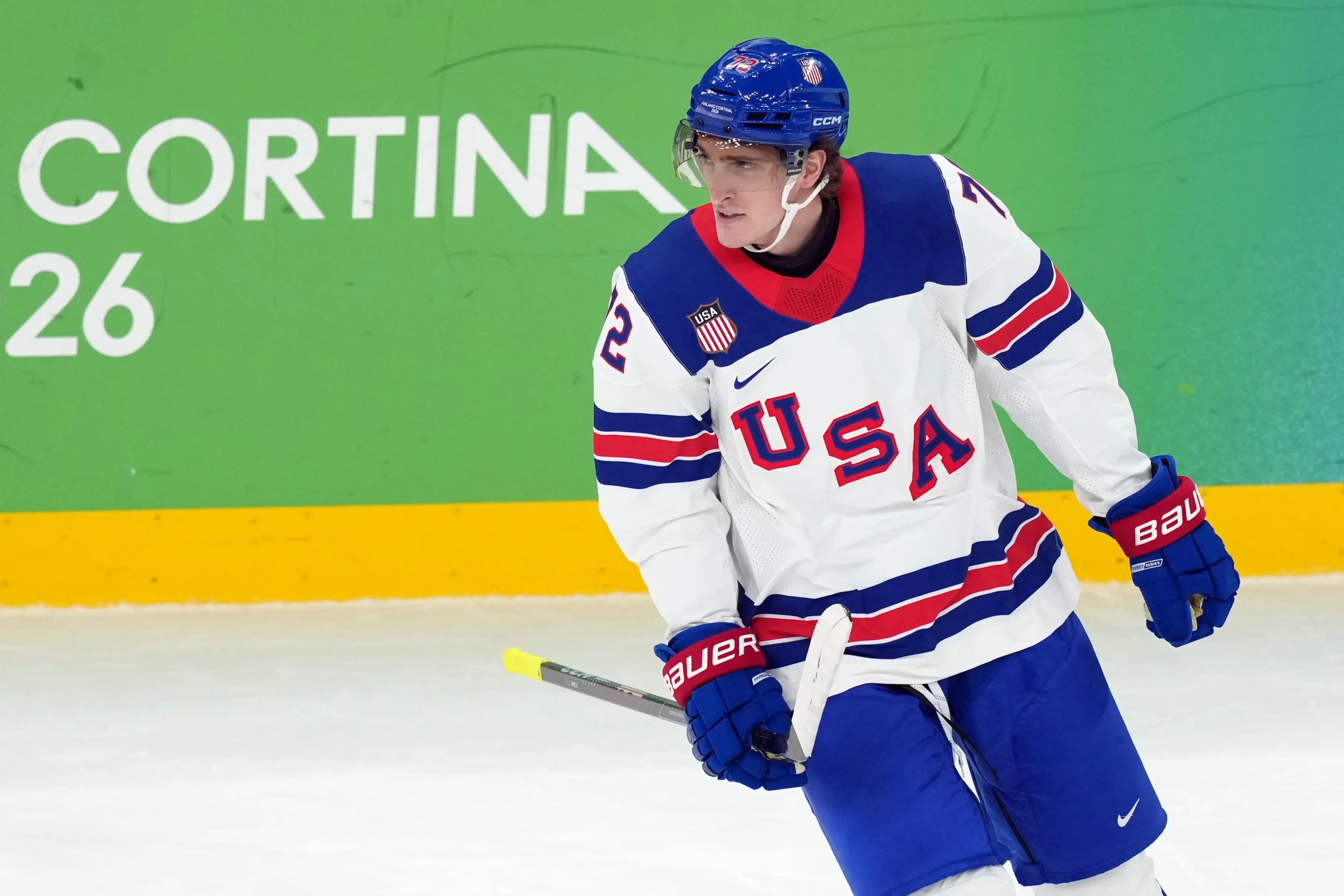 United States’ Tage Thompson skates past the bench after scoring...
