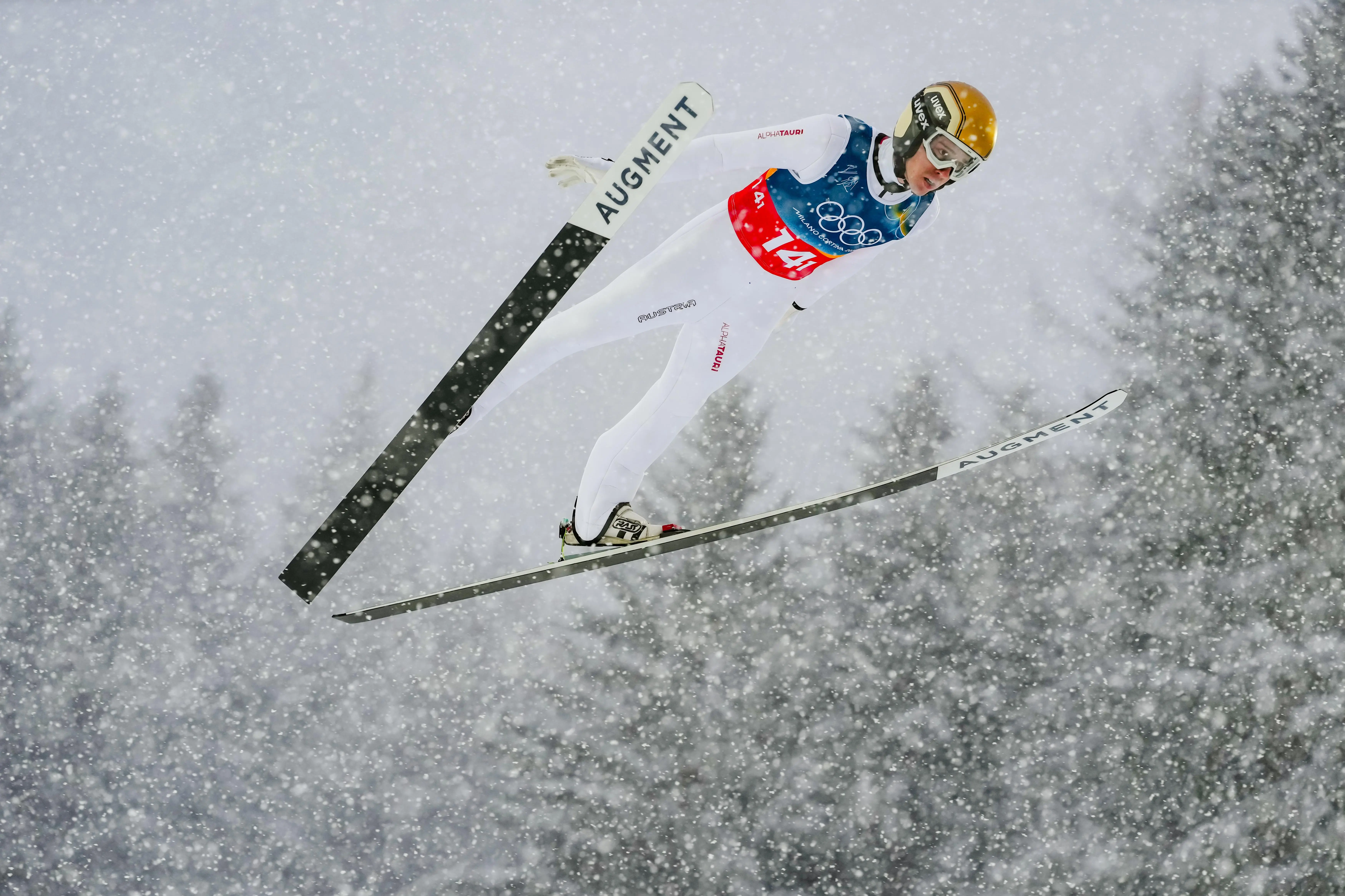 Stefan Rettenegger, of Austria, soars through the air during the...