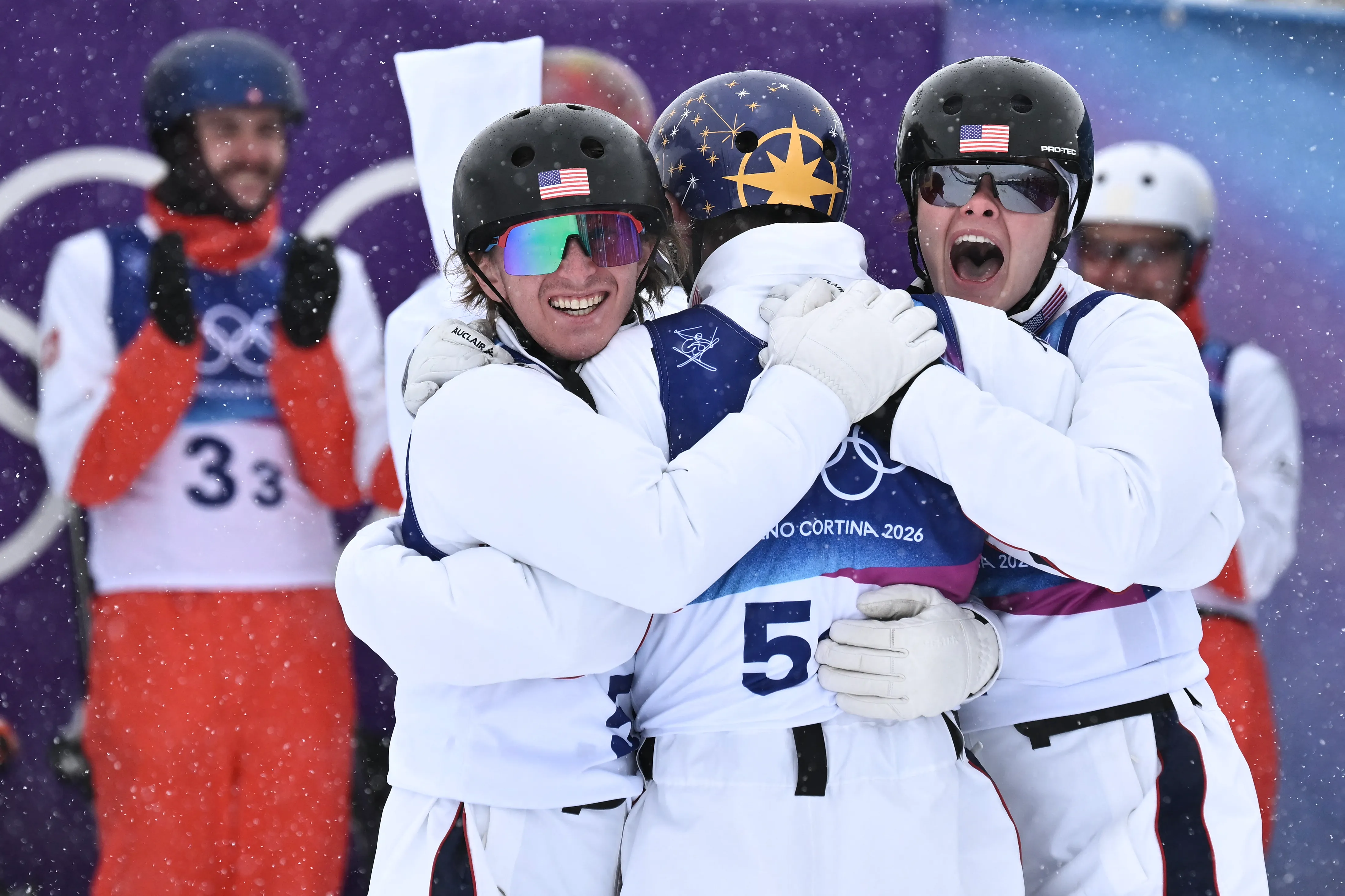 USA's Christopher Lillis, USA's Connor Curran and USA's Kaila Kuhn celebrate their victory