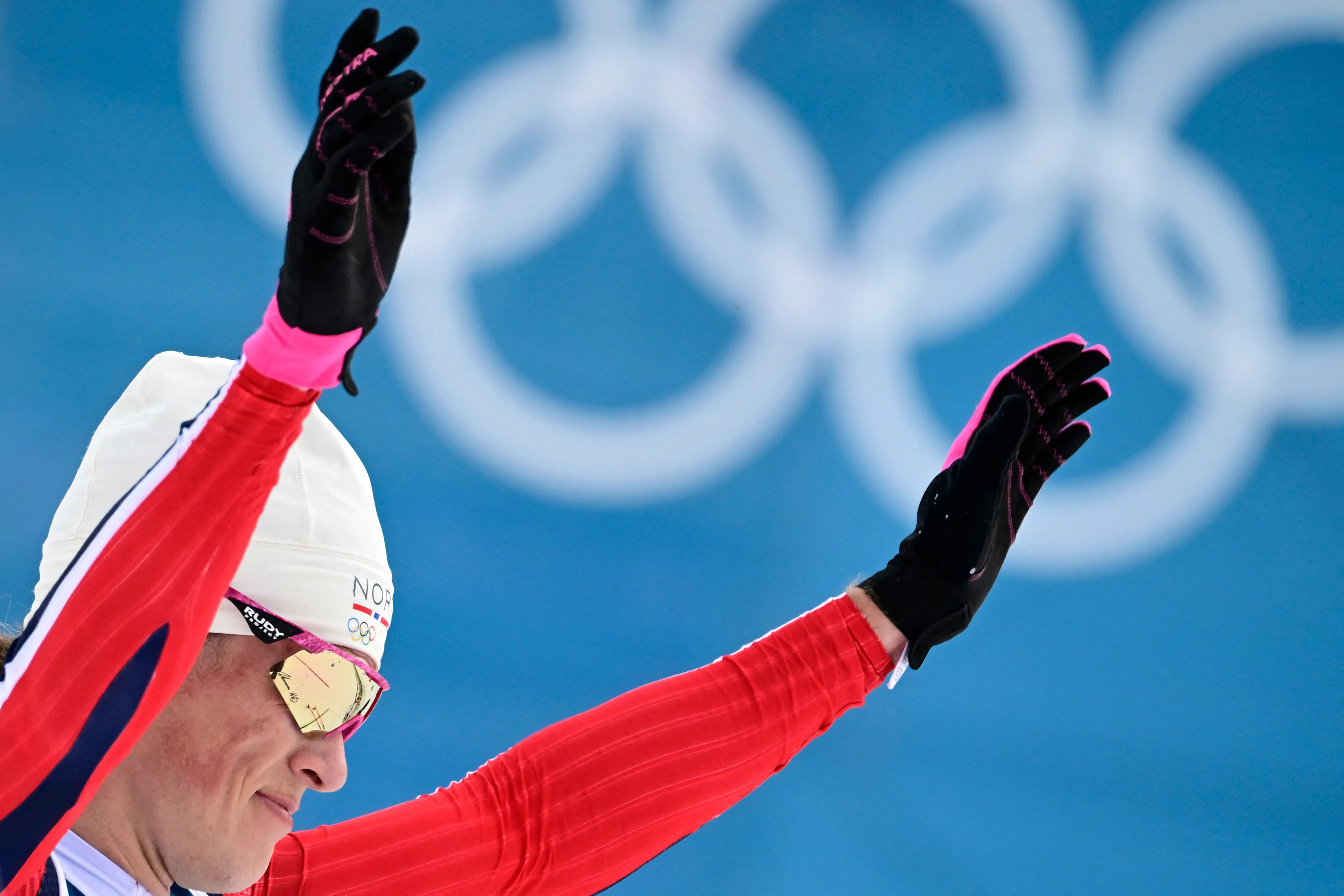 Norway's Johannes Hoesflot Klaebo reacts after he crossed the finish line