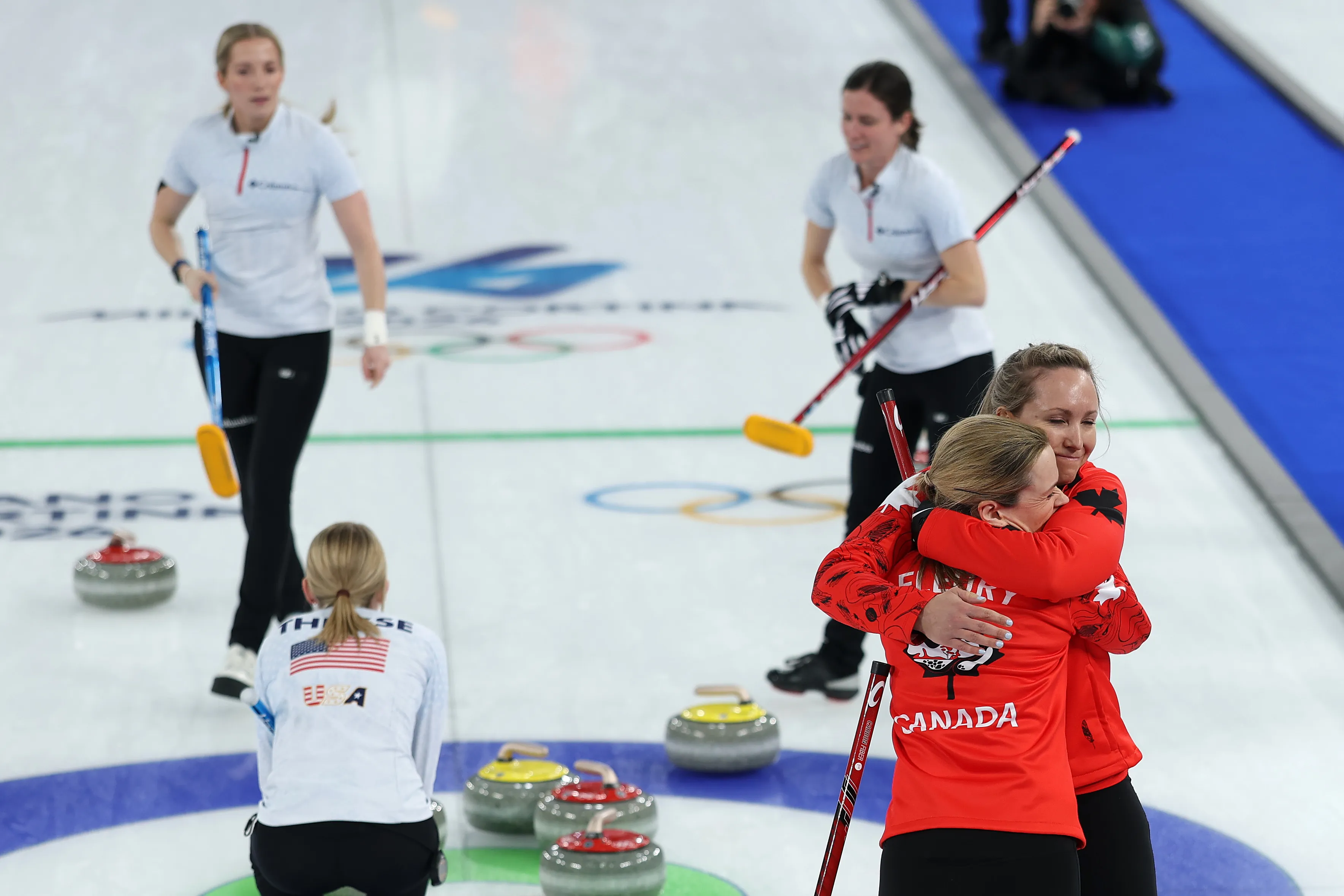 Rachel Homan and Tracy Fleury of Team Canada celebrate after victory in the Women's Bronze Medal match between Team Canada and Team United States.
