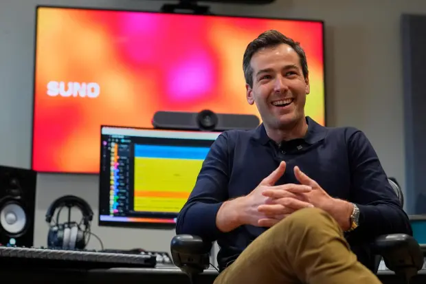 Mikey Shulman, a founder of Suno, speaks to a reporter at company headquarters.