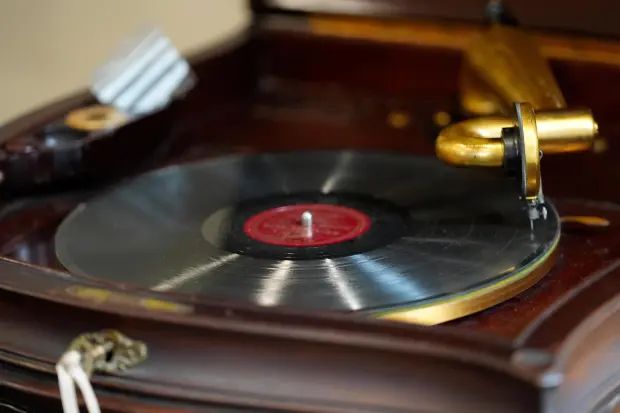 An old-fashioned record player plays in the office of Mikey Shulman.