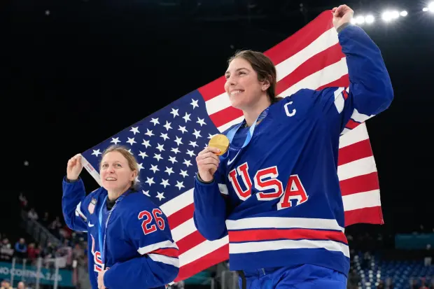 Kendall Coyne and Hilary Knight celebrate after a victory ceremony 