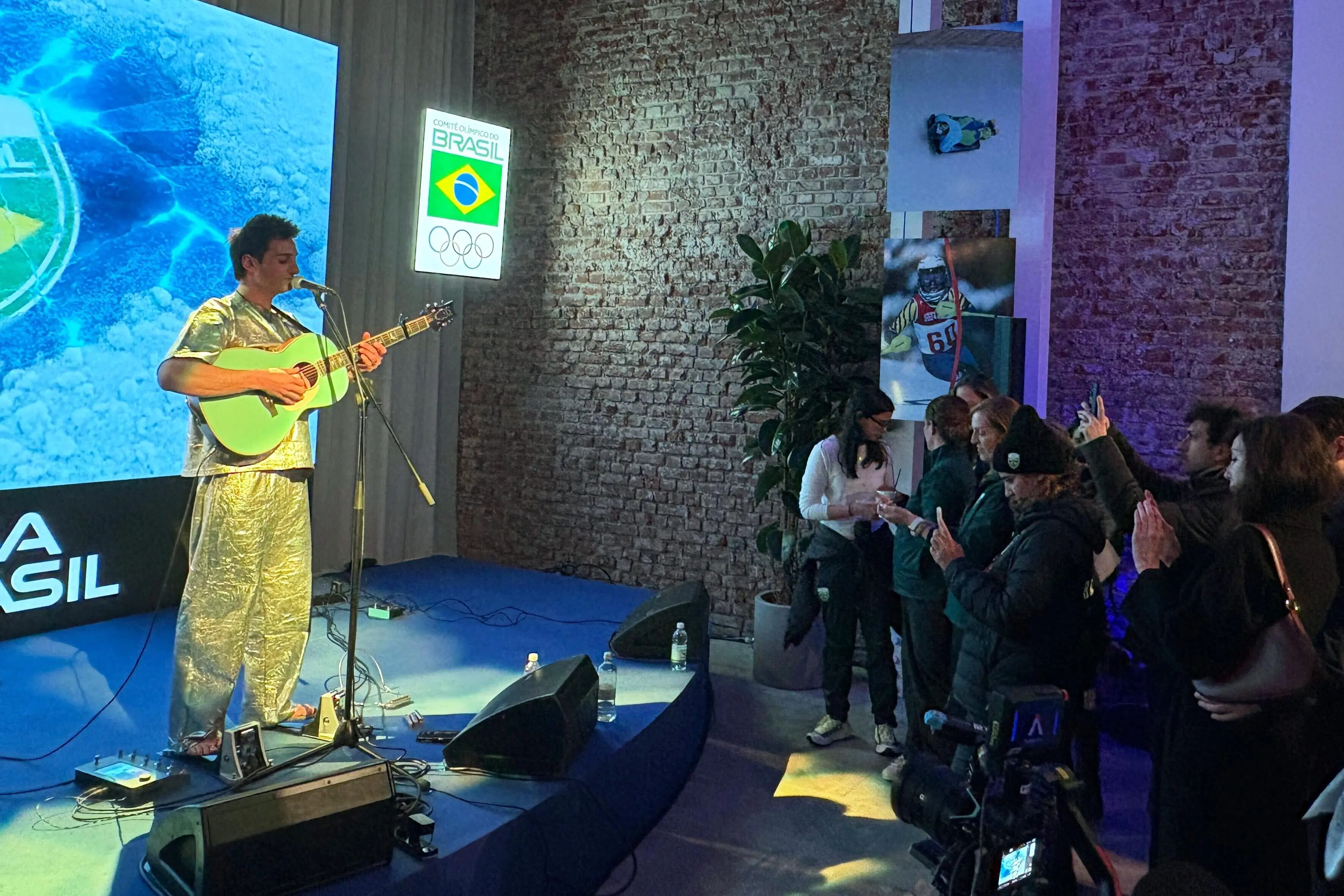 Brazilian snowboarder Pat Burgener plays a concert at the Brazil House.