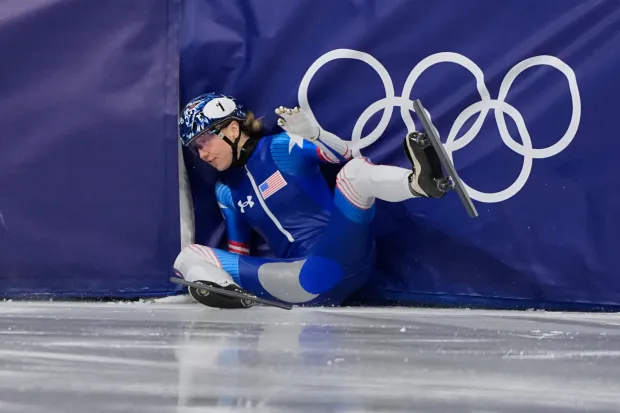 Kristen Santos-Griswold of the United States crashes during the short track speed skating women's 500m at the 2026 Winter Olympics, in Milan, Italy, Thursday, Feb. 12, 2026. (AP Photo/Natacha Pisarenko)