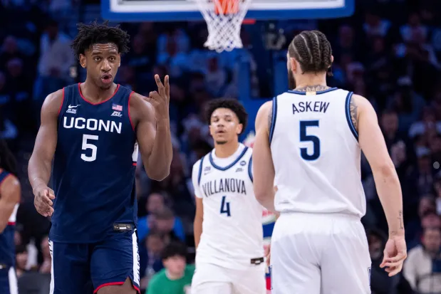 UConn's Tarris Reed Jr., left, reacts during an NCAA college basketball game against Villanova, Saturday, Feb. 21, 2026, in Philadelphia. (AP Photo/Chris Szagola)