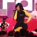 Cardi B falls off chair in concert, keeps singing, jokes about spat with Trump admin