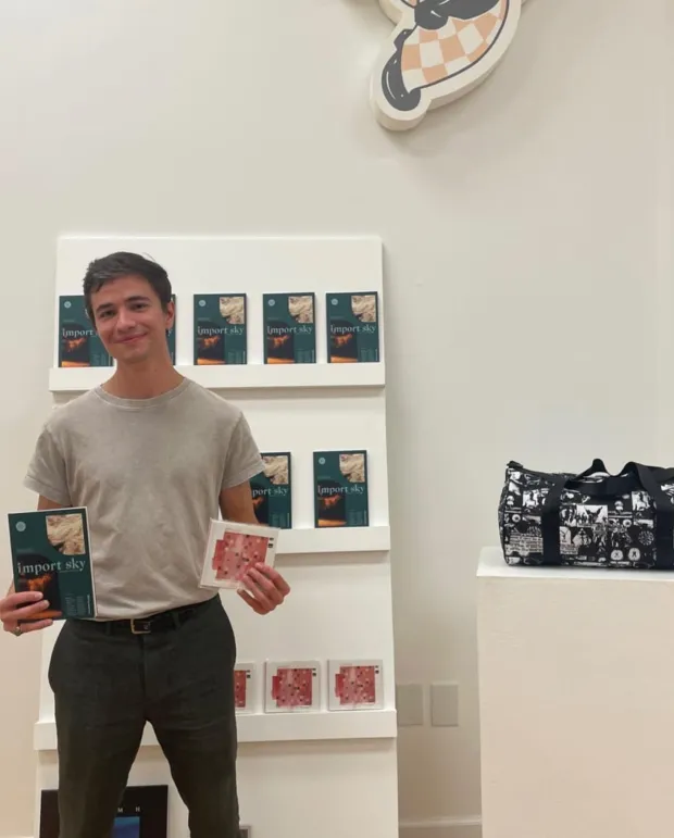 Funnybone Records founder Dylan Healy with some of the label's releases. (Siara Watrous)