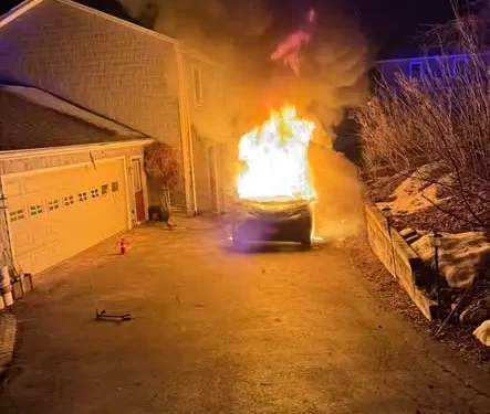 PHOTOS: Hybrid vehicle fire causes minor damage to nearby house in Cheshire