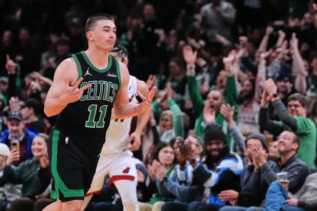Boston Celtics guard Payton Pritchard (11) celebrates after hitting a 3-point basket during the second half of an NBA game against the Miami Heat, Friday, Feb. 6, 2026, in Boston. (AP Photo/Charles Krupa)