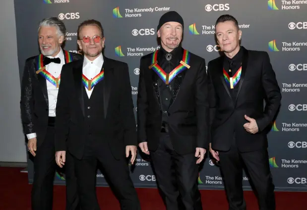 FILE - Adam Clayton, from left, Bono, The Edge and Larry Mullen Jr., of the Irish band U2, arrive at the Kennedy Center Honors in Washington on Dec. 4, 2022. (Photo by Greg Allen/Invision/AP, File)