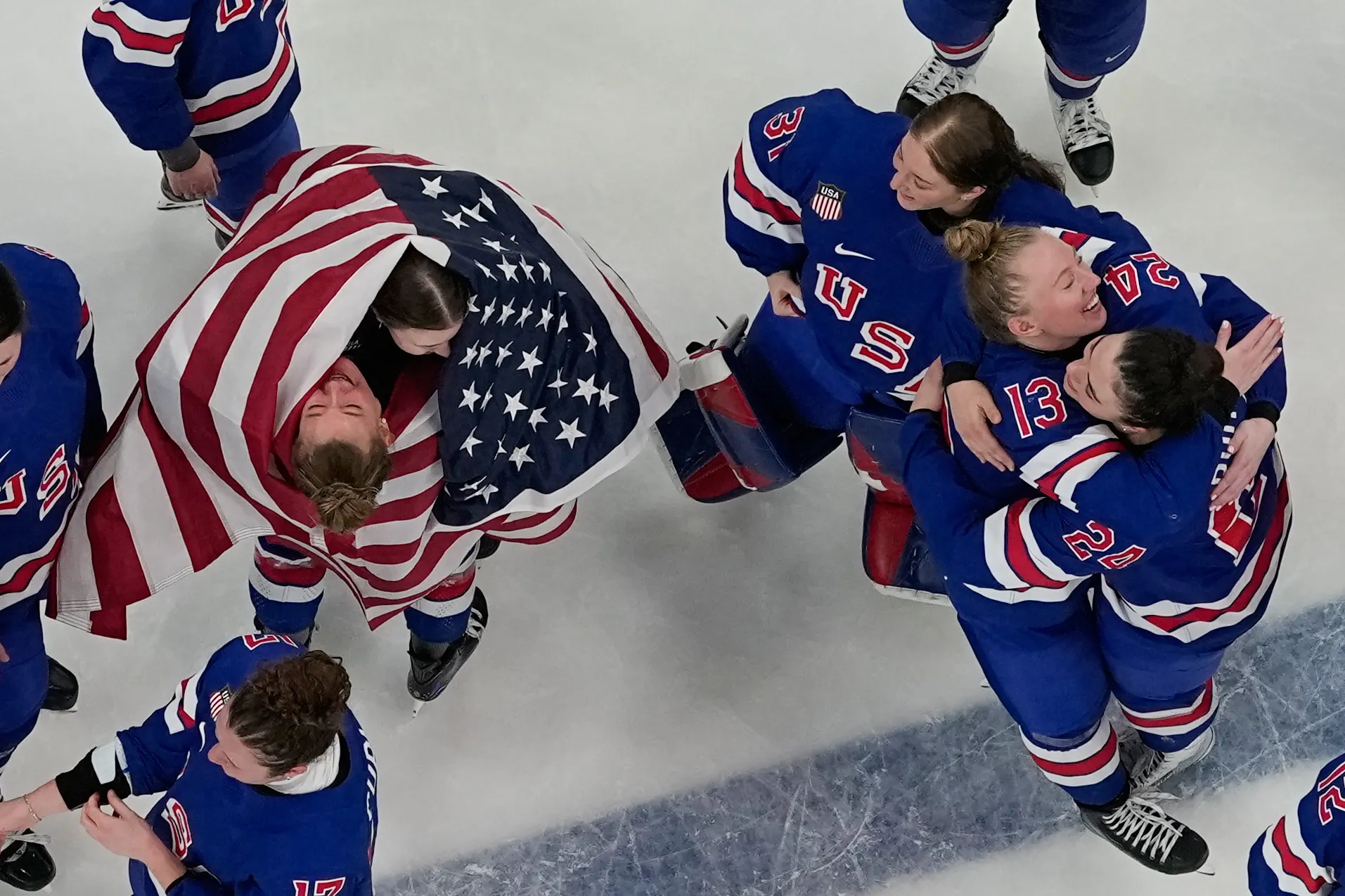 Team United States players celebrate after beating Canada 2-1 in...