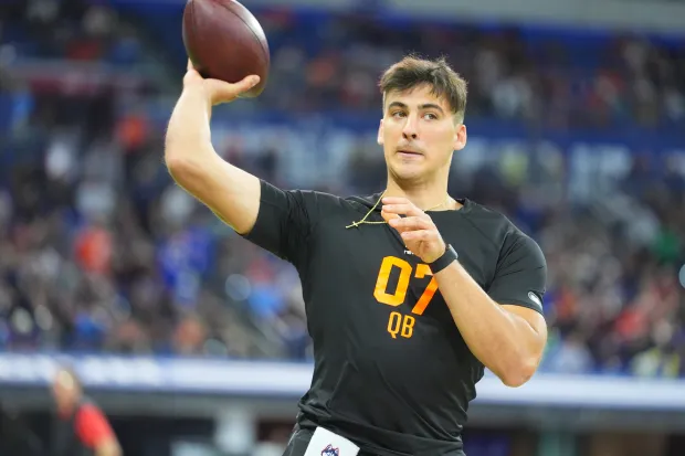 UConn quarterback Joe Fagnano (07) runs a drill at the NFL football scouting combine in Indianapolis, Saturday, Feb. 28, 2026. (AP Photo/Julio Cortez)