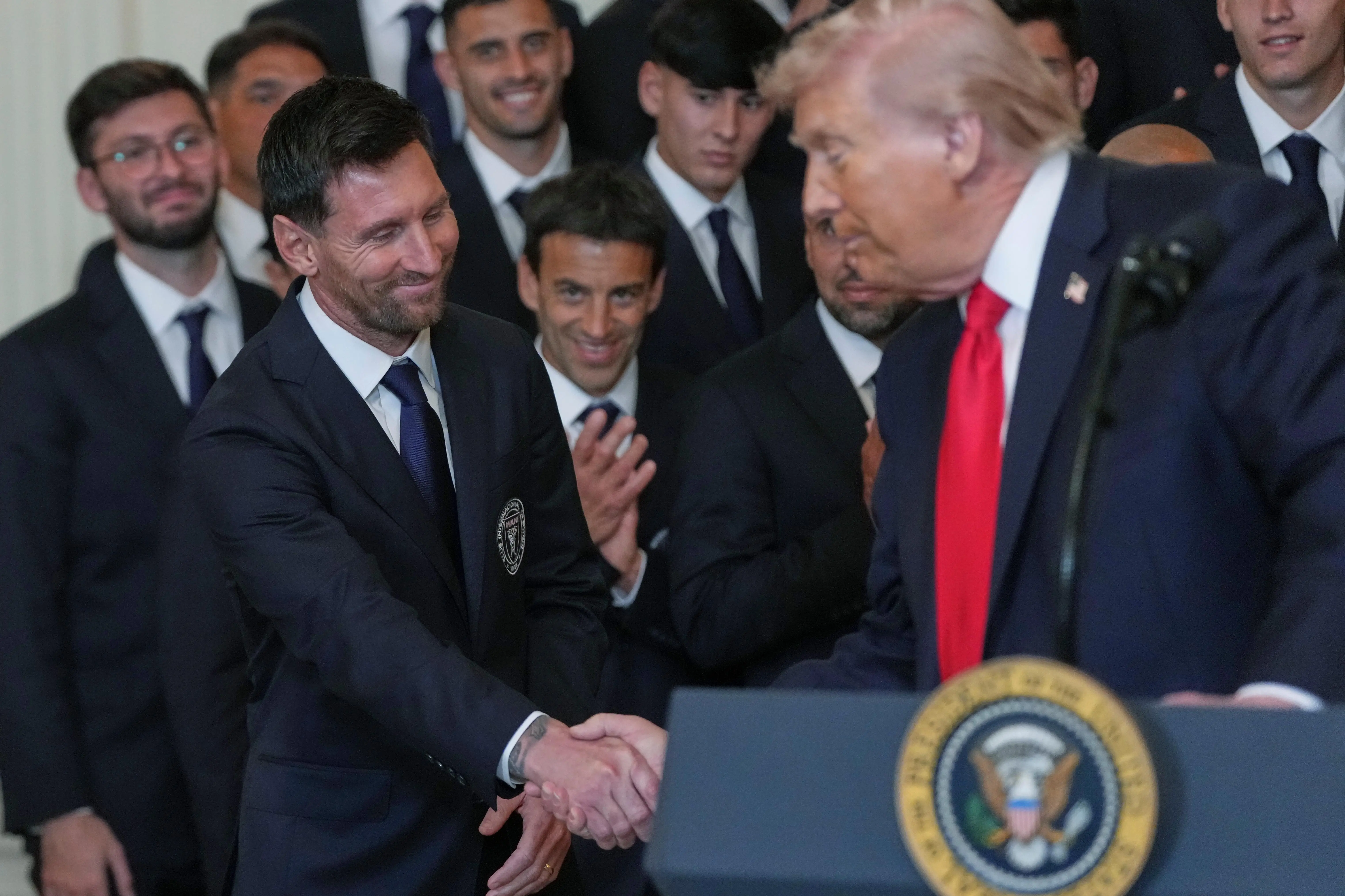 President Donald Trump shakes hands with Lionel Messi during an...