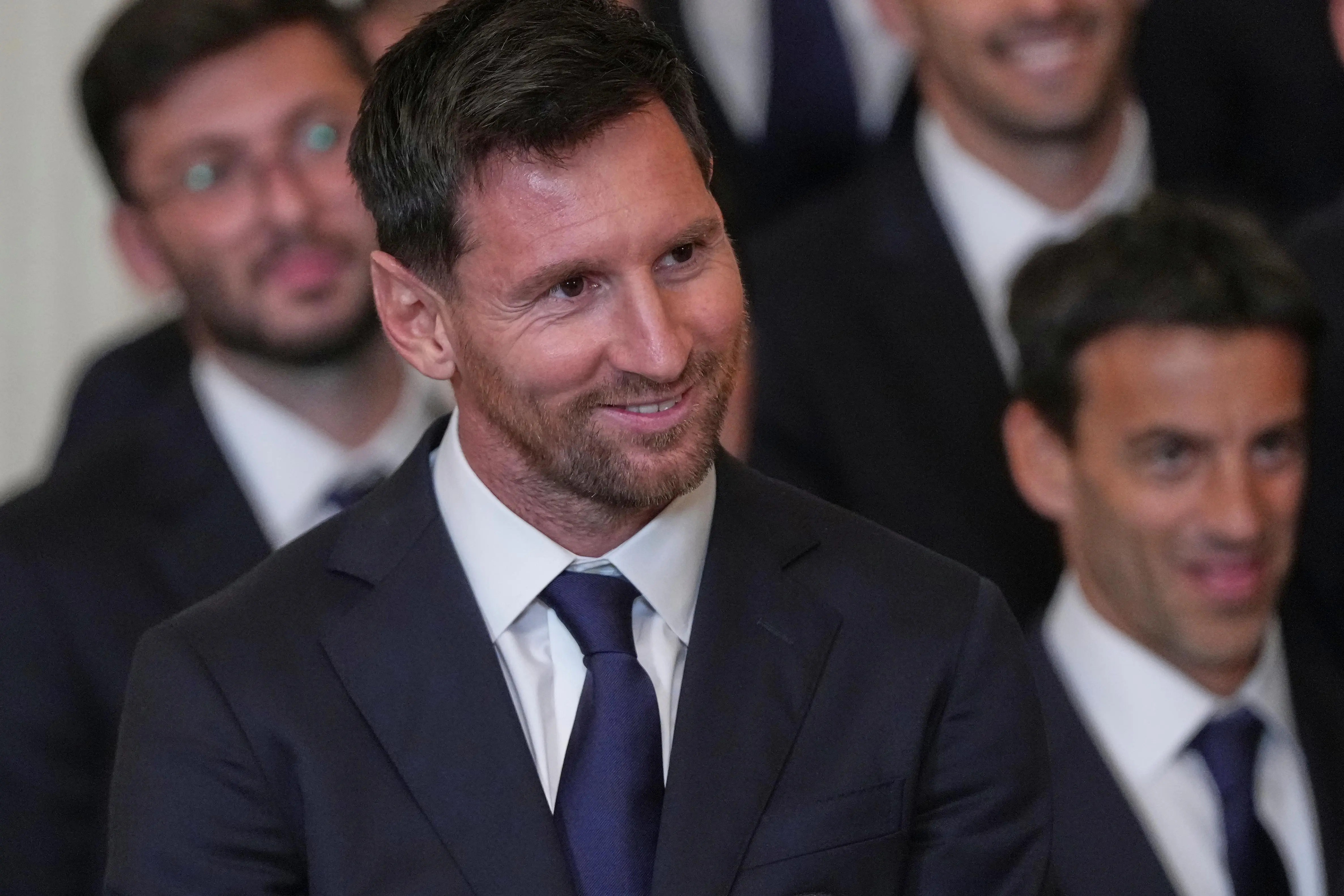 Lionel Messi listens to President Donald Trump speak during an...