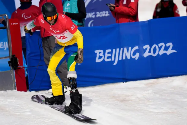 A Brazilan athlete starts during a training session ahead of a para snowboard event. 