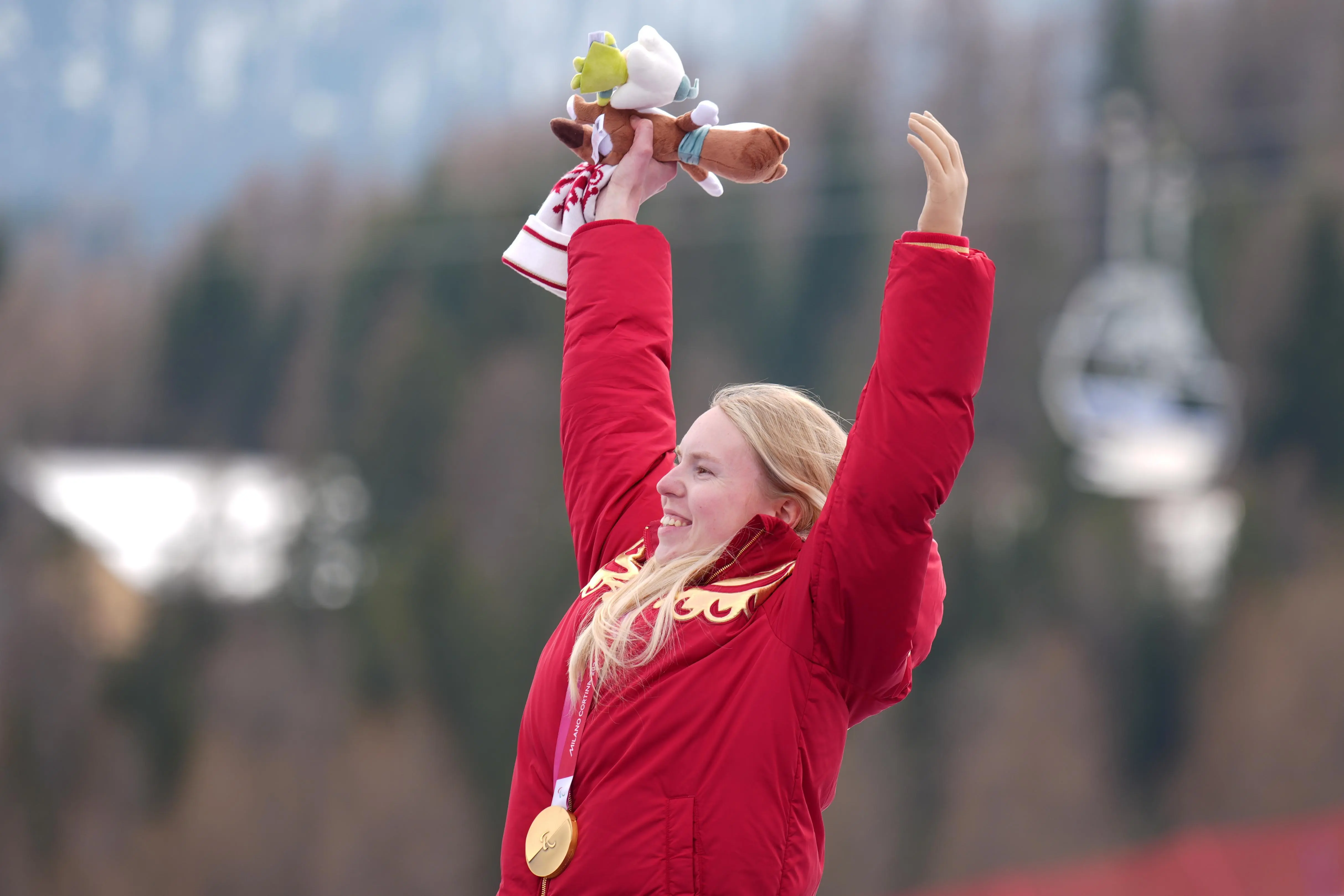 Varvara Voronchikhina, of Russia, smiles on the podium after winning a gold medal.