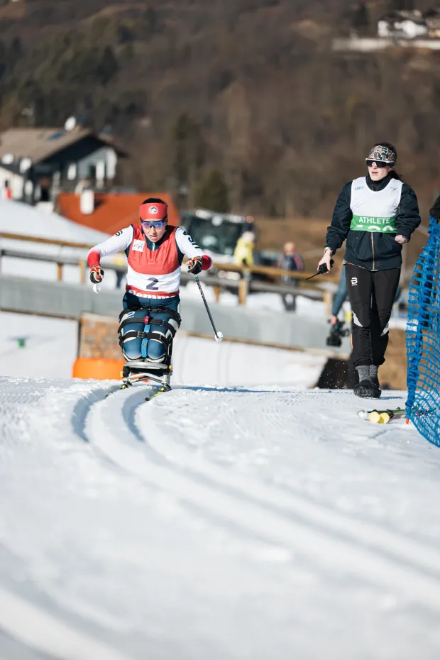 Nicole Zaino, who grew up in Brookfield and was partially paralyzed on one side by a stroke when she was 8, competes in Nordic sit skiing at a World Cup last year. (Photo by Gaia Panuzzo)