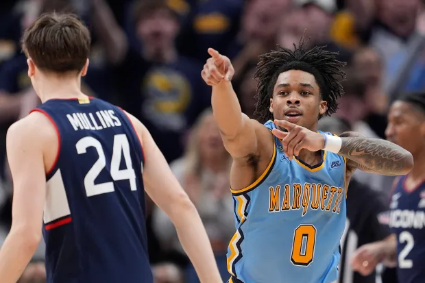 Marquette's Nigel James Jr. celebrates after making a three point basket against the Connecticut Huskies during the second half at Fiserv Forum on March 07, 2026 in Milwaukee. (Patrick McDermott/Getty Images)