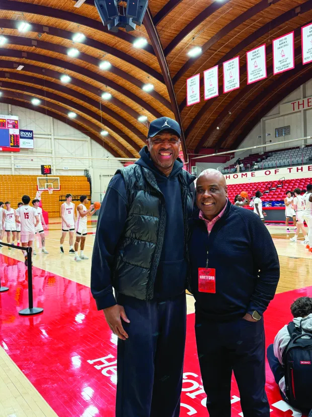 Former University of Hartford all-time basketball great and Connecticut native Vin Baker, left, and university President Lawrence Wared. (Courtesy of UHart) 