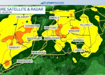 Rain chances return through a breezy Sunday