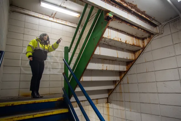Hartford Parking Authority CEO Khouloud "Kay" Al Mannai shows the deteriorated stairwell, closed to the public, at the MAT Garage in downtown Hartford. It will be replaced in an upcoming renovation this summer. (Aaron Flaum/Hartford Courant)