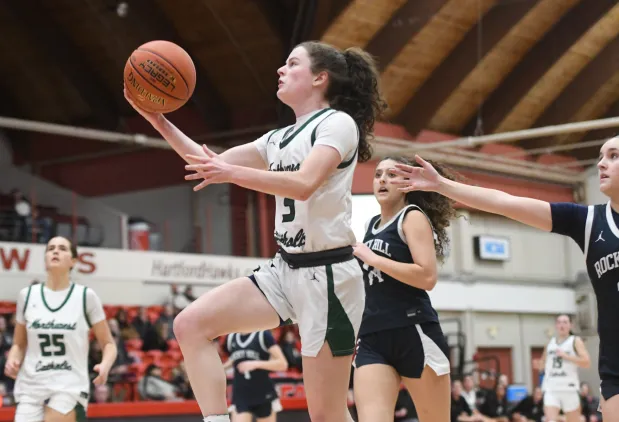 Northwest Catholic's Maeve Staunton goes to the hoop in first half of the CCC girls basketball championship game against Rocky Hill Monday night at the University of Hartford. (Photo by Lori Riley)
