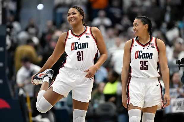UConn forward Sarah Strong (21) and UConn guard Azzi Fudd (35) smile in the first half of an NCAA college basketball game against Tennessee, Sunday, Feb. 1, 2026, in Hartford, Conn. (AP Photo/Jessica Hill)