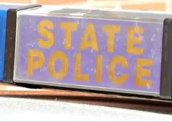 One person hospitalized after crashing against pole in Colchester