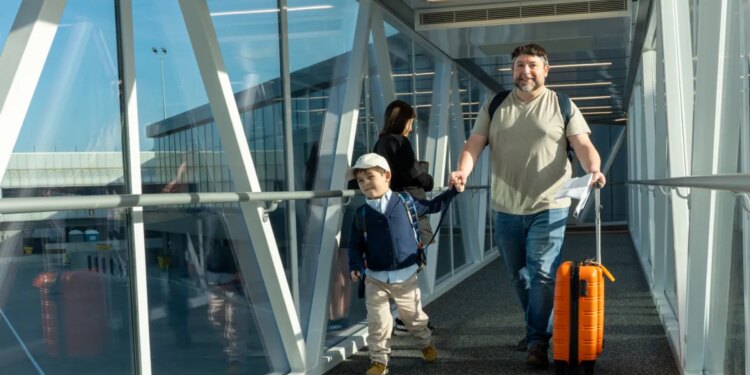Families practice boarding a plane in ‘Autism Flies' event at Bradley