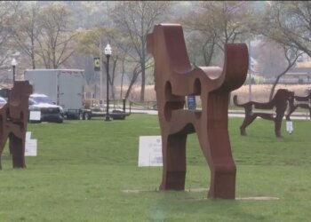 Dog sculptures towering over Savin Rock boardwalk in West Haven