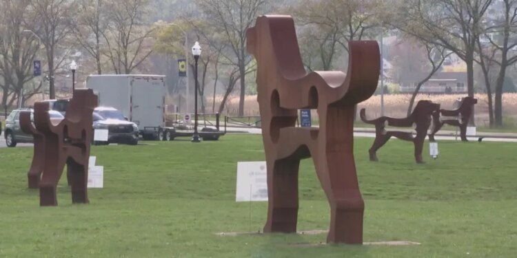 Dog sculptures towering over Savin Rock boardwalk in West Haven