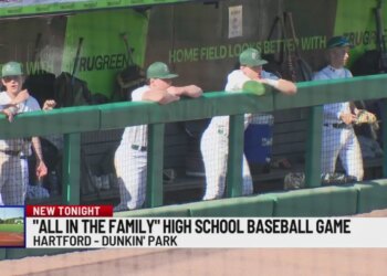 High school baseball game has family on all sides