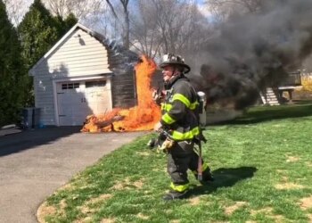 PHOTOS: Flames engulf lawnmower outside Norwalk home