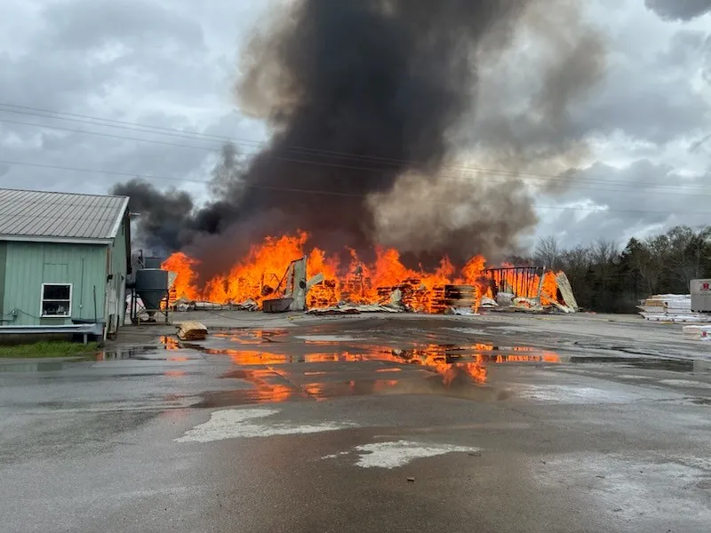 Flames engulf a building at Robbins Lumber in Searsmont, Maine. A fire and explosion left at least one firefighter dead at the mill on Friday, May 15, 2026.