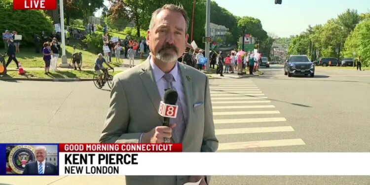 A hundred protestors gather outside Coast Guard Academy ahead of President Trump's speech