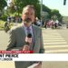A hundred protestors gather outside Coast Guard Academy ahead of President Trump's speech