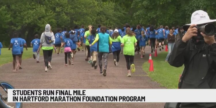 Connecticut students crossing finish line of youth running program