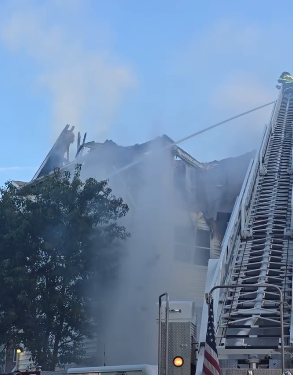 Firefighters fighting apartment fire in Groton Sunday morning