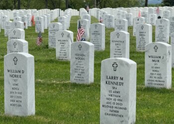 Volunteers place nearly 14,000 flags at veterans cemetery ahead of Memorial Day