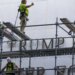 Workers begin removing Trump's name from the Kennedy Center, hours after a court-ordered deadline