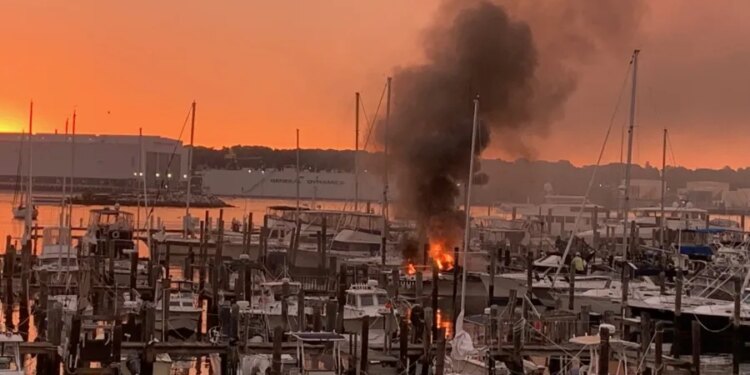 Fire crews battle boat fire at Burr's Marina in New London