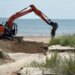 Heavy rain carves deep canyons into West Haven beach