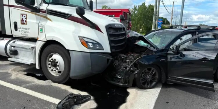 PHOTOS: Crash, 'significant' fluid spill closes Route 5 in South Windsor