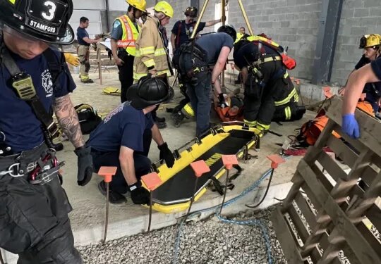 PHOTOS: Stamford firefighters rescue injured construction worker from water cistern