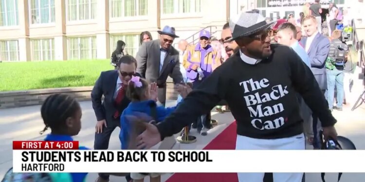 Community group cheers on kids returning to school in Hartford