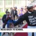 Community group cheers on kids returning to school in Hartford